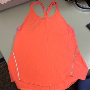 LULULEMON Women’s Orange Tank with Reflective detail Hi/Lo Hem Size 6 Thin
